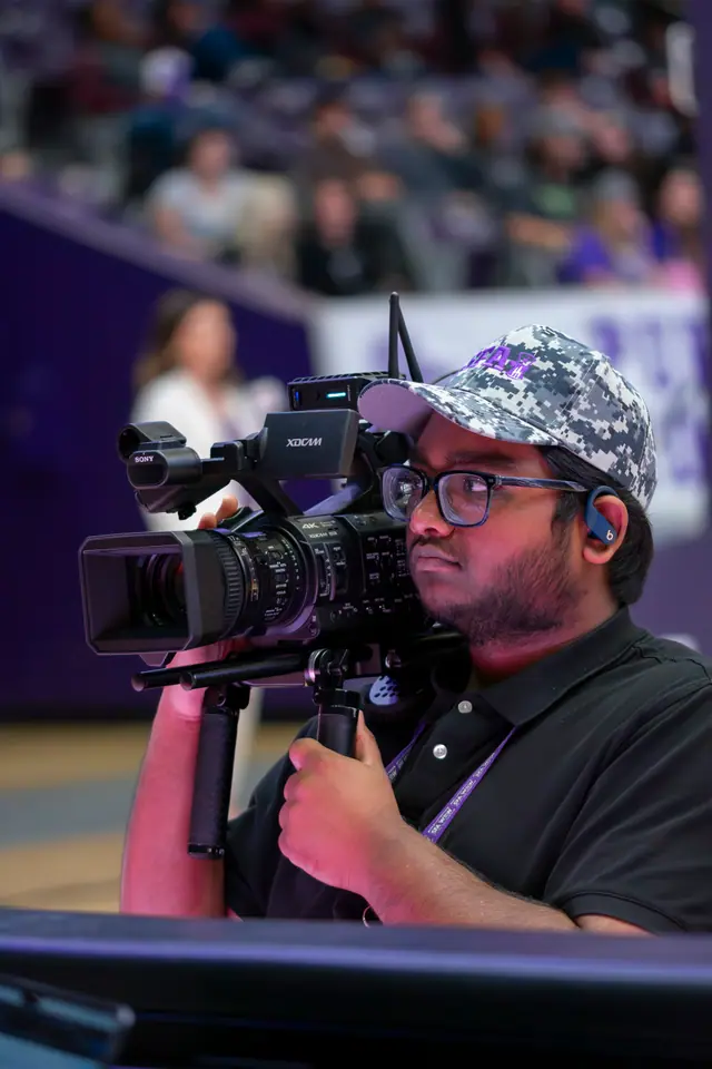 Camera operator setting up a shot on location