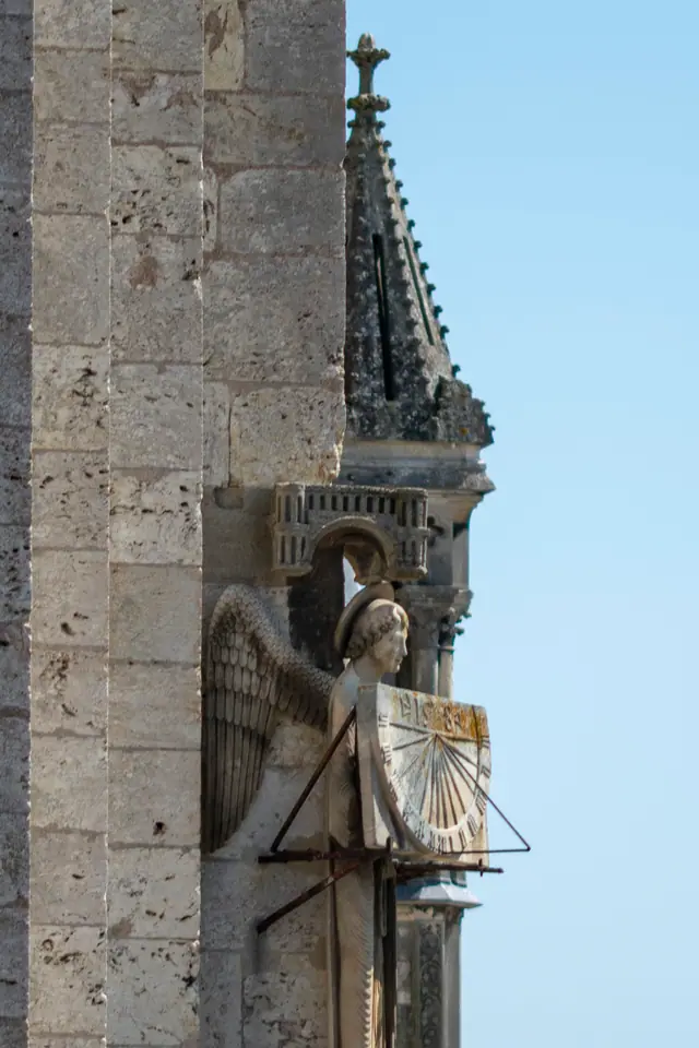 The Angel with the Sundial carved on the corner of Chartres Cathedral's south tower